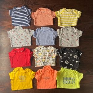 12 short sleeve Carter’s onesies